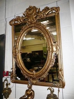 Lot 649 - A reproduction gilt framed mirror