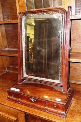 Lot 662 - A Georgian mahogany swing mirror