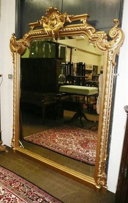 Lot 669 - A large gilt overmantel mirror