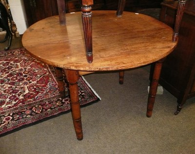 Lot 672 - Circular fruitwood table