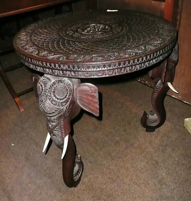 Lot 674 - Burmese teak elephant table