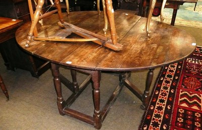 Lot 687 - An 18th century oak gateleg table