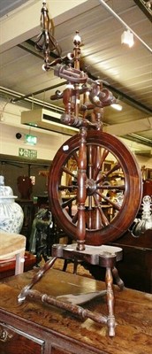 Lot 691 - A spinning wheel