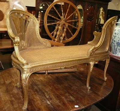 Lot 703 - A French gilt and cane seated conversation settee