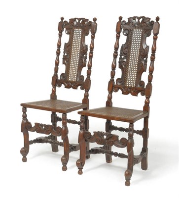 Lot 706 - Pair of late 17th century walnut carved chairs