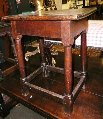 Lot 711 - An oak joint stool