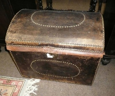 Lot 723 - Leather and studded domed trunk