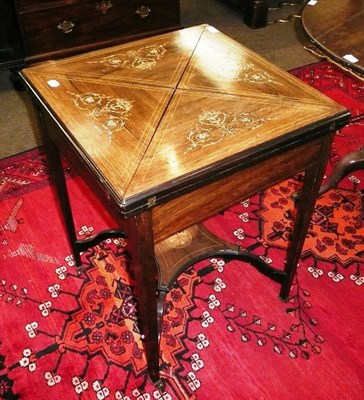 Lot 728 - An Edwardian rosewood inlaid envelope card table