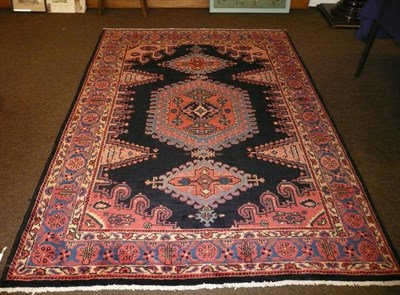 Lot 732 - Vise Rug, North West Persia The indigo field with triple linked medallions framed by spandrels...