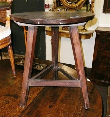 Lot 744 - Oak cricket table on stained pine legs