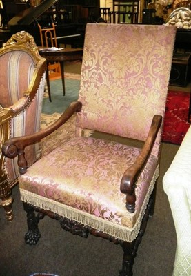 Lot 748 - A 17th century-style walnut framed open armchair, upholstered in pink and gold floral dralon...