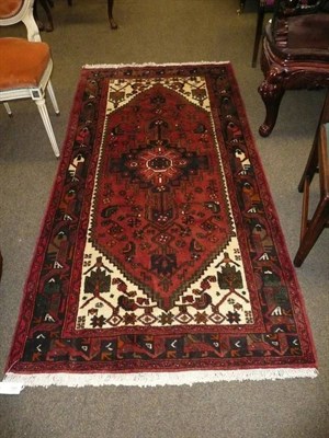 Lot 769 - Hamadan rug, Persian Kurdistan The stepped lozenge field with a deep indigo stepped medallion...