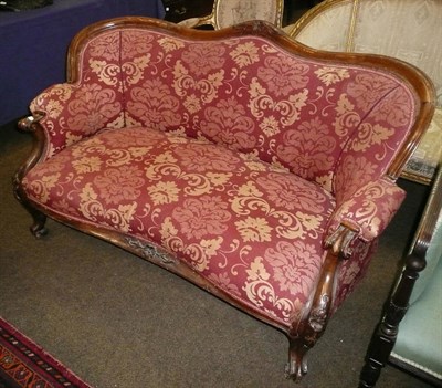 Lot 773 - A Victorian red upholstered sofa with carved supports