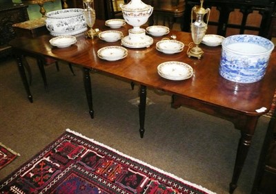 Lot 796 - Georgian mahogany dining table with two leaves