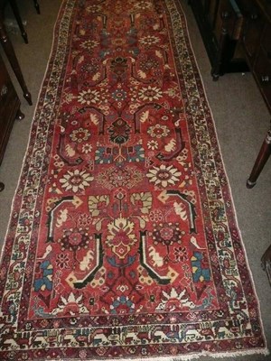 Lot 800 - A Malayir runner west Persia The candy pink field of large flowerheads enclosed by narrow...