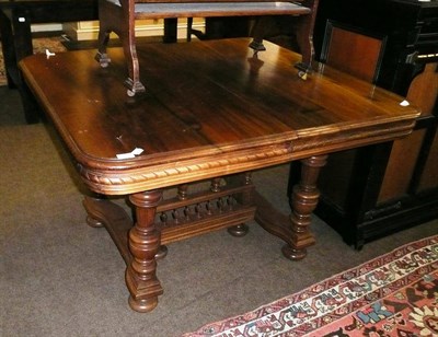 Lot 809 - A Continental walnut dining table