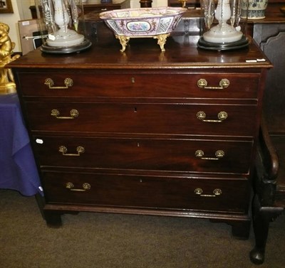 Lot 841 - George III mahogany chest of four long drawers on bracket feet