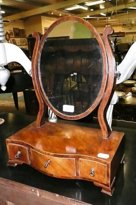 Lot 869 - A Regency serpentine toilet mirror