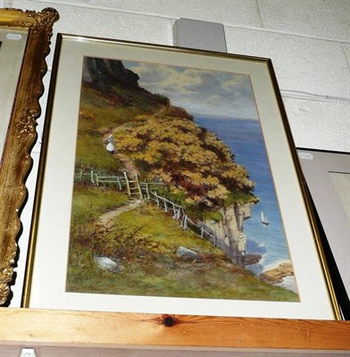 Lot 925 - Framed watercolour of a young girl walking on a cliff top path