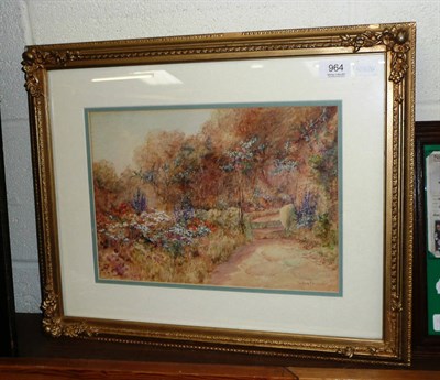 Lot 964 - Leyton Forbes, watercolour, thatched cottage with blooming garden, framed