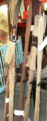 Lot 1043 - Quantity of vintage fishing rods and a pair of skis