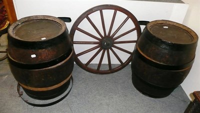 Lot 1049 - Two oak barrels of staved construction and a single cart wheel