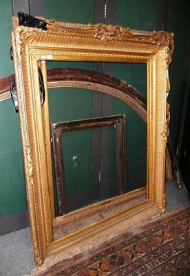 Lot 1063 - Two large gilt and gesso picture frames and a small picture frame