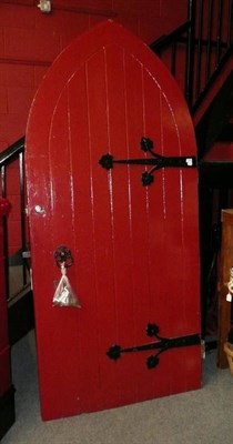 Lot 1068 - An arched Gothic style door with wrought iron hinges