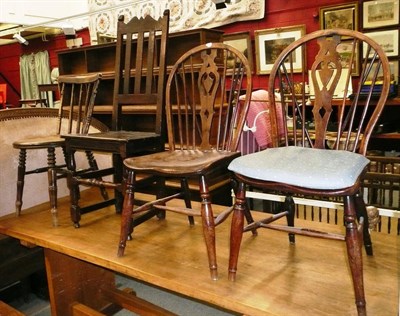 Lot 1105 - A pair of yew and elm Windsor chairs, an oak high back dining chair and an Ibex chair