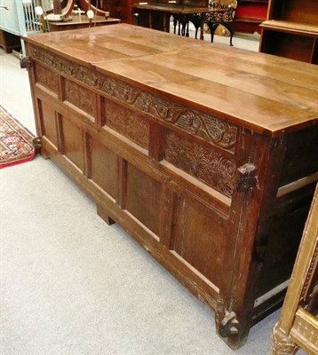 Lot 1109 - A large panelled oak coffer with later lid