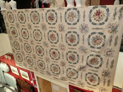 Lot 1115 - Large needlepoint carpet of European design, China The ivory field with rows of leafy floral...