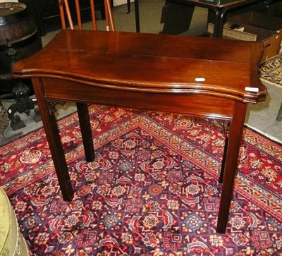 Lot 1146 - A mahogany Chippendale-style fold over card table