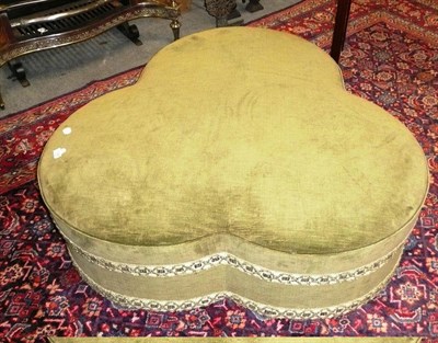 Lot 1148 - A green velvet shaped pouffe