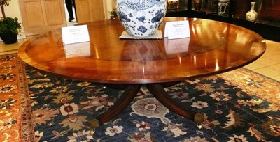 Lot 1163 - Large mahogany circular table and leaves