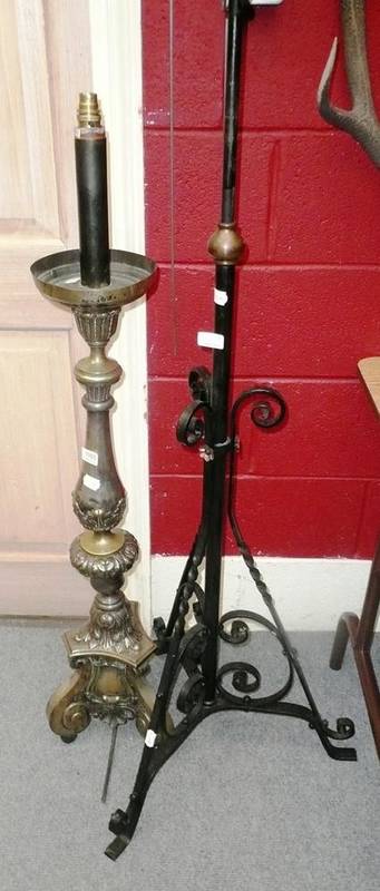 Lot 1165 - Wrought iron adjustable standard lamp and a smaller metal standard lamp
