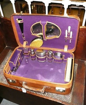 Lot 1183 - Leather vanity case initialled SKH, with a purple canvas lining and chrome mounted fittings