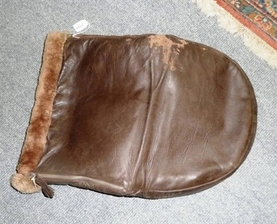 Lot 1194 - A sheepskin lined leather foot warmer