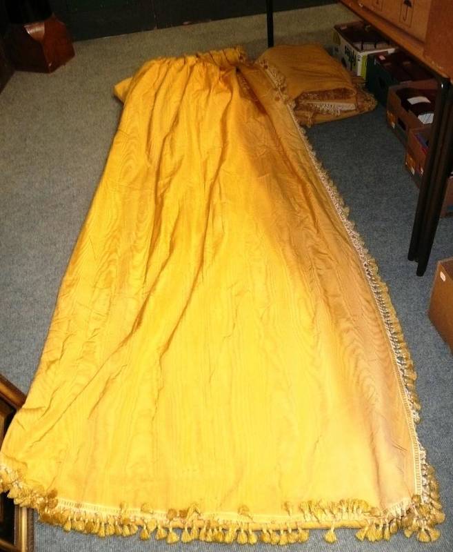 Lot 1244 - Two pairs of yellow moire silk curtains, with tassel trims, line and interlined, length 288cm