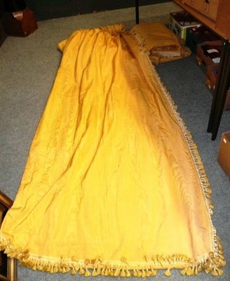 Lot 1244 - Two pairs of yellow moire silk curtains, with tassel trims, line and interlined, length 288cm