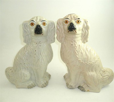Lot 5 - Pair of large late Victorian Staffordshire pottery seated spaniels in white and gold