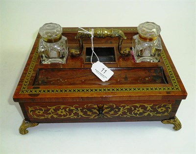 Lot 11 - George IV inkstand in brass inlaid rosewood with drawer and two wells