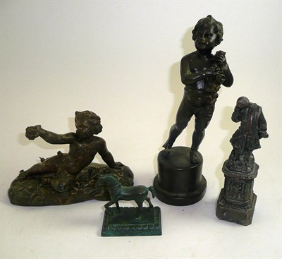 Lot 13 - A small bronze horse and three bronzed figures