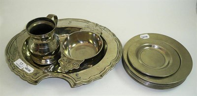 Lot 17 - Old pewter oval barber's bowl, pint mug, eight medium plates, two small plates and a porringer