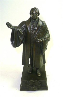 Lot 22 - Bronze figure of a scholar with arm outstretched and holding a bible