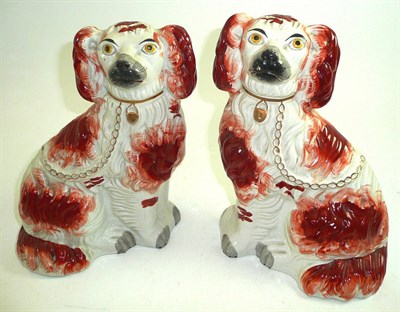 Lot 28 - Pair of Victorian Staffordshire pottery seated spaniels with rust markings
