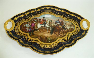 Lot 52 - A 19th century Sèvres style tray in blue and gold background painted with a French battle scene