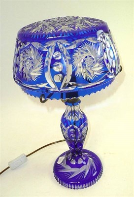 Lot 55 - A blue cut glass table lamp