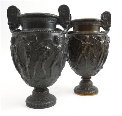 Lot 80 - Two similar cast bronze twin handled vases, decorated