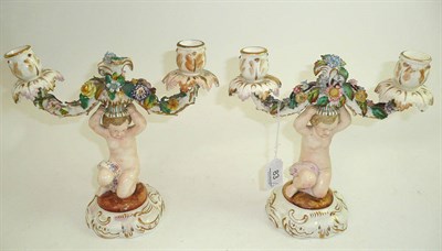 Lot 83 - Pair of floral decorated candlesticks
