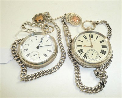 Lot 101 - Two silver open faced pocket watches, two silver watch chains and two attached silver medals